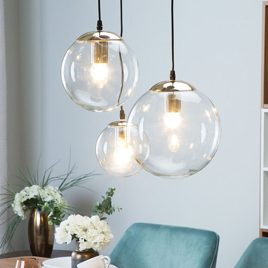 3 Light Pendant Lamp With Transparent Glass Spheres And Golden Metal Accents For Modern Glam Interiors